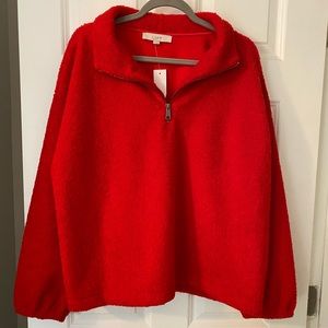 Woman’s red pullover